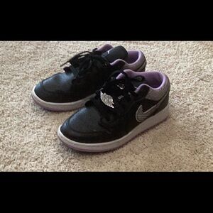 Nike air Jordan’s purple and black shoes with lace charms